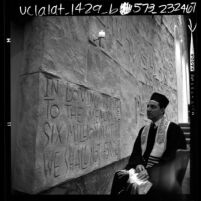 Rabbi Jacob Pressman of Los Angeles' Temple Beth Am, beside "Memorial Wall to the Martyred Six Million Jews", 1966