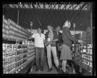 Shoppers in the canned food aisle on opening of a Ralph's Market in Los Angeles, Calif., 1941