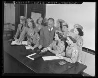 Women's Ambulance and Defense Corps of America members studying radio operations, Calif., 1941