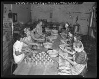 Group of volunteer workers from the Mormon Church shown canning tuna in Long Beach, Calif., 1941