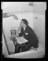 Artist Salvador Dali seated in a bathtub at the Ambassador Hotel in Los Angeles, Calif., 1944