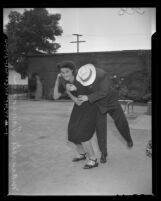 Margrete Taricco demonstrating how she defended herself against attacker in Los Angeles, Calif., 1945