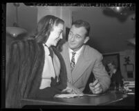 Actors John Wayne and Esperanza Baur applying for marriage license in Los Angeles, Calif., 1946