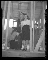 Will and Lillian Heath with children amongst partially built house in Pasadena, Calif., 1946