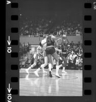 Wilt Chamberlain playing against Los Angeles Lakers' Gail Goodrich and Darrall Imhoff, 1967