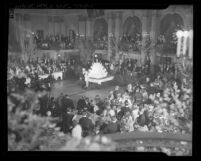 President Franklin D. Roosevelt's 55th Birthday party with Shirley Temple and Eddie Cantor standing before cake at the Biltmore in Los Angeles, Calif., 1937