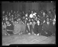 Negro Nite Life on Central Avenue..Series, Group of African American clubgoers in front of stage in Los Angeles, Calif., 1938
