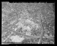 Aerial view of massive excavation and construction work for the interchange joining Arroyo Seco [Pasadena], Harbor, Hollywood and Santa Ana freeways, East Los Angeles, 1948