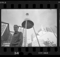 Artist Robert Wilhite with his work "Gyro/Cone" on display in downtown Los Angeles, Calif., 1986