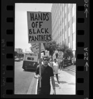 Pickets out front State Office Building in Los Angeles with signs stating "Free Huey P. Newton" and "Hands off the Black Panthers", 1968