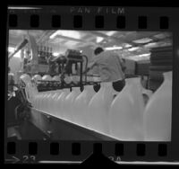 Plastic milk bottles on the production line at Western Preformed Container Co., Covina, Calif., 1968