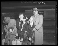 Displaced persons from the Baltics; Israel Kader, his wife Lola and children arrive in Los Angeles, Calif., 1949