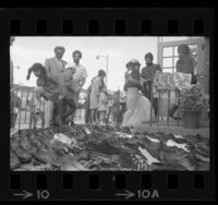 People removing their shoes at entrance of Sikh Temple (Gurdwara Vermont) before dedication ceremony, Los Angeles, Calif., 1969