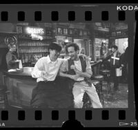 Actors Gedde Watanabe and Ned Eisenberg on set of television series "Gung Ho," Los Angeles, Calif., 1986