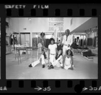 Herbert Fink with four saleswomen at Theodore boutique in Los Angeles, Calif., 1970