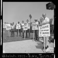 Gubernatorial candidate Jesse M. Unruh standing with striking workers at General Motors Assembly plant in South Gate, Calif., 1970