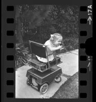 Susie Critchfield riding her UCLA designed motorized wheelchair in Garden Grove, Calif., 1971