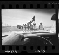 Chicanos on "La Marcha de La Reconquista," walking along road near the Salton Sea, Calif., 1971