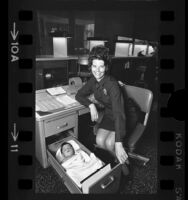 Abandoned baby sleeping in desk drawer at Los Angeles Police station, 1971
