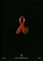 Red condom bent into the shape of a red AIDS ribbon [descriptive]