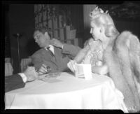 Jane Churchill with Eddie Norris at nightclub, Norris displaying injury from Hall-Dorsey brawl, Los Angeles, Calif., 1944