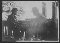 Two men playing checkers, from Arai Family black photograph album