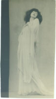 Ruth St. Denis, Salome, pre-1940 [leaning back, hand to chest, white dress]