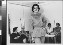 Black and white photographs of Cashin's ready-to-wear designs for Sills and Co., modeled in Sills' showroom.