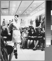 Black and white photographs of Cashin's ready-to-wear designs for Sills and Co., modeled in Sills' showroom.