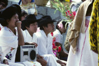 Guelaguetza[?], performers sitting with spectators, 1982 or 1985