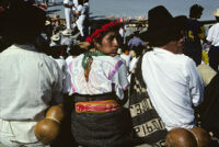 Guelaguetza[?], performers sitting with spectators [view from behind], 1982 or 1985