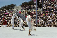 Tehuantepec, man carrying fake fish chased by net, 1982 or 1985