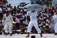 Tehuantepec, man carrying fake fish on shoulder, 1982 or 1985