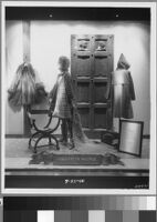Photographs of Cashin's ready-to-wear designs for Sills and Co. featured in department store windows.
