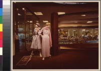 Photographs of Cashin's ready-to-wear designs for Sills and Co. featured in department store windows.
