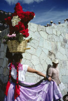 Chines de Oaxaca, woman holding flower basket on head, 1982