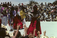 Ejutla de Crespo, performers handing gifts to spectators, 1982