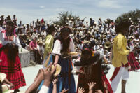 Ejutla de Crespo, performers throwing gifts to spectators, 1982