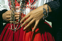 Ejutla de Crespo, close-up of woman's hands and beads at waist, 1982