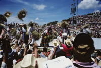 Tlaxiaco, performers throwing straw hats to spectators, 1982 or 1985