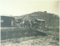 Raid scene with cowboys and indians on western town set at Universal City, Calif., 1915