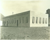 Adobe or cinder block building with long windows at Universal City, Calif., 1915