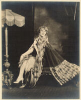 Peggy Hamilton modeling a pink sequin gown and cape of apple green velvet, 1927