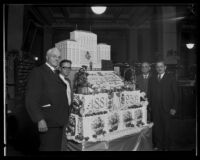 Harry Chandler and others with giant Los Angeles Times 50th Anniversary cake, 1931