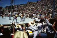 Macuiltianguis, performers throwing gifts to spectators, 1985