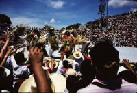 Macuiltianguis, performers throwing straw hats to spectators, 1985
