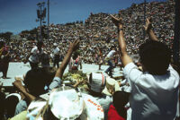 Flor de Pina, performers throwing gifts to spectators, 1982