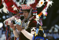 Saints Day, man looking at a polaroid picture, 1982