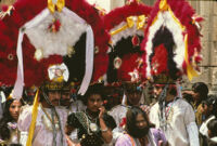 Saints Day, men wearing large headdresses, 1982