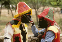 Saints Day, men wearing black masks, 1982